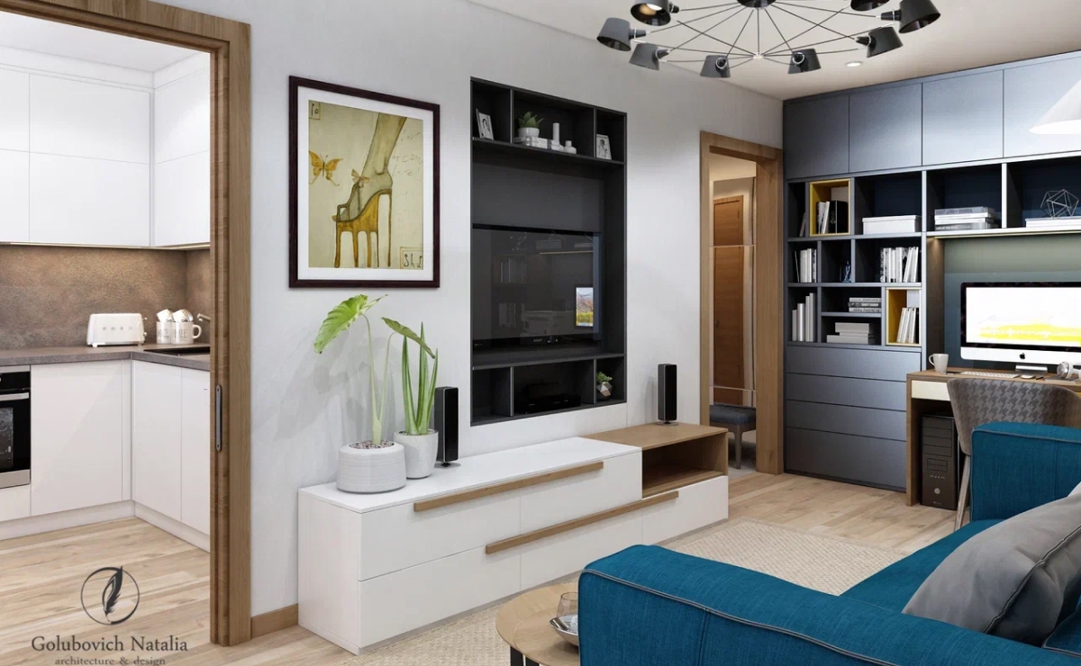 За время разработки дизайн-проекта был создан продуманный до мелочей интерьер, где молодой паре было бы удобно отдыхать, работать и принимать гостей. По просьбе заказчиков предусмотрено множество мест хранения: стеллажи, вместительный шкаф в прихожей и в спальне, нашли место даже для электрогитары. <br><br>

В квартире сделали небольшую перепланировку. Изначально совмещенный санузел был очень маленький, поэтому приняли решение увеличить его площадь за счет коридора. Ванная комната стала просторнее – появилась возможность разместить душевую кабину. <br>
На кухне оборудование для готовки разместили вдоль двух стен, а у окна интегрировали столешницу для приема пищи. Хозяйке очень понравилось, что на небольшой кухне удалось разместить необходимую технику (встроенный холодильник, посудомоечную машину, духовой шкаф), а также немало шкафов для хранения. <br><br>

Спальня по форме вытянута «в виде пенала». За счет расположения встроенного шкафа вдоль стены и небольшого выступа разделили комнату на две части и придали ей более правильную форму. В отделке применили два цвета обоев, чтобы подчеркнуть зональность. Полноценная двуспальная кровать примыкает изголовьем к стене, на которую установили панели из ДСП и зеркала. Вместительный шкаф от пола до потолка поможет содержать гардероб заказчиков в порядке. <br><br>

Интерьер квартиры получился интересным и нескучным благодаря деталям: акцентные обои, яркие вставки в конструкции мебели, в обивке, деревянные панели с зеркальной расшивкой.
